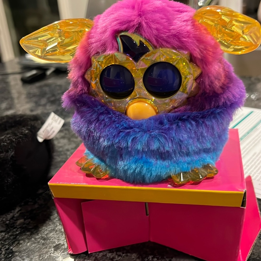 Furby with gold crystal ears, still connected to with original box